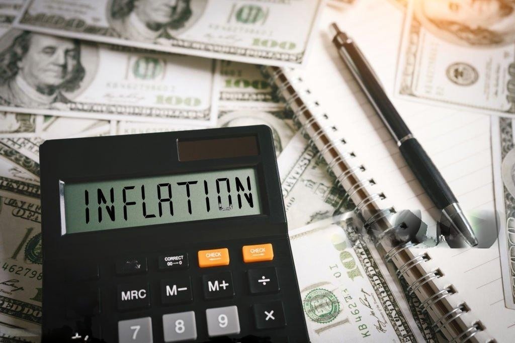 Graphic of financial charts and inflation icons, illustrating rapid inflation effects.